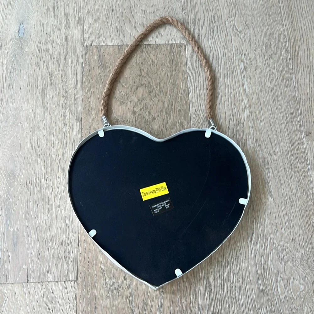 White hanging heart mirror on a rope. Coastal.